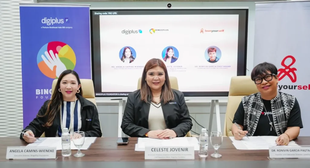 Angela Camins-Wieneke, Celeste Jovenir and Dr. Ronivin Garcia Pagtakhan sign an agreement with LoveYourself