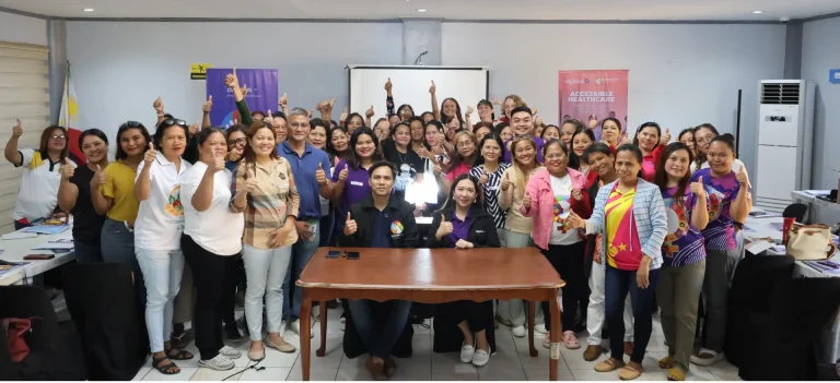 Barangay health workers give a thumbs up with BingoPlus Foundation staff after a mental health first aid workshop